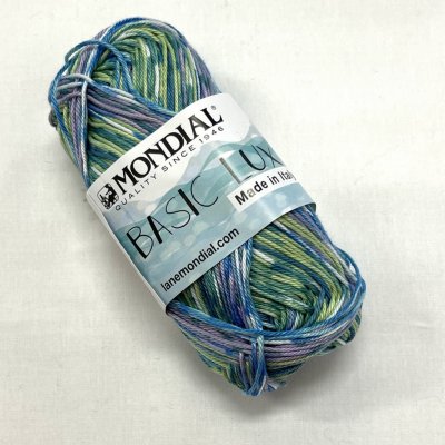 Mondial bomullsgarn, färg 957 melerad lila/grön/ljusblå, nystan á 50g.